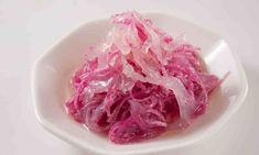 a white bowl filled with red cabbage