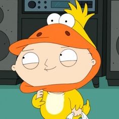 a cartoon character standing in front of a speaker system with an orange hat on his head