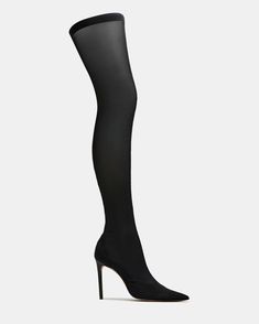 The TATE boots offer a sleek and sophisticated look with their mesh pointed-toe design and thigh-high height. The stiletto heel adds a touch of elegance while elongating the legs. Perfect for making a statement and elevating any outfit.  4 inch heel height Size 6 measurements: 14.5 inch shaft circumference, 23 inch shaft height  Size 8 measurements: 15.75 inch shaft circumference, 24 inch shaft height Size 10 measurements: 16.5 inch shaft circumference, 25 inch shaft height  Textile and PVC upper material Unlined Synthetic sock Synthetic sole  Imported Toe Socks, 4 Inch Heels, Toe Designs, Dress Sandals, Black Leather Boots, Stiletto Heel, Dress With Boots, Thigh Highs, Women's Boots