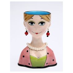 a ceramic figurine with a blue hat on it's head