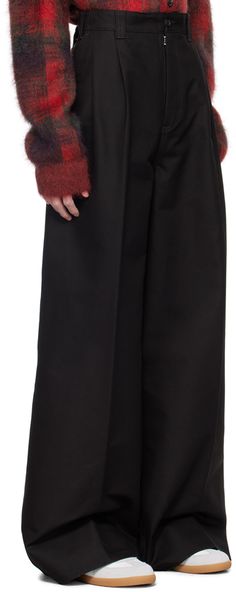 Cotton twill trousers. · Belt loops at partially elasticized waistband · Four-pocket styling · Zip-fly · Pleats at front · Creased legs · Extended cuffs · White stitching at back Supplier color: Black Baggy Formal Pants For Fall, High-waisted Pants With Elastic Cuffs, Solid High-waisted Pants With Elastic Cuffs, Workwear Trousers With Elastic Cuffs, Black Wide-leg Pants With Elastic Cuffs, Black Pants With Elastic Cuffs For Fall, Black Wide Leg Pants With Elastic Cuffs, Elastic Cuff Trousers For Work, Black Bottoms With Elastic Cuffs For Fall