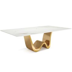 a white marble table with gold legs and an abstract design on the top, against a white background