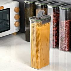 there are many different types of food in the kitchen and on the counter, as well as an electric toaster