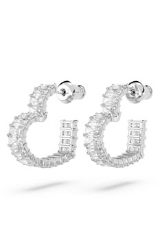 Baguette-cut pavé crystals trace these heart-shaped earrings in signature Swarovski shine and will add a romantic glow to any look, day or night. 5/8" drop; 1/8" width Post back Rhodium plate/Swarovski crystal Imported Swarovski Heart Earrings, Diamond Heart Earrings, Swarovski Jewelry Earrings, Glitter Accessories, Shiny Earrings, Cute Jewellery, Swarovski Heart, New Money, Silver Diamond Earrings