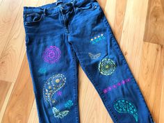 Women's size 14/32 Gap denim capris, upcycled with painted paisley, flower, and butterfly design on front and back.  This is a nice pair of longer capris pants that can be rolled up if desired.  They have been painted with paisley type designs in yellow coral, pink and green. DETAILS: Size:  14/32 girlfriend style Brand:  Gap Materials:  99% cotton, 1% spandex MEASUREMENTS: Waist:  34 inches Hips:  41 inches Inseam:  26-1/2 inches Front Rise:  11 inches Back Rise:  15-1/2 inches Circumference bottom of leg:  14 inches Be sure to check the size and measurements.  Sizing for clothing brands is often different! Hint:  To be sure this item will fit, lay your favorite pants/jeans out flat and take measurements of the same areas listed above. These are upcycled jeans, meaning previously owned/pr Fitted Bohemian Jeans For Summer, Hippie Style Jeans For Summer Festival, Summer Festival Hippie Jeans, Bohemian Summer Festival Jeans, Bohemian Jeans For Summer Festivals, Bohemian Non-stretch Jeans For Summer, Bohemian Spring Pants With Paisley Print, Casual Paisley Print Bottoms For Spring, Summer Bohemian Festival Jeans