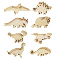 wooden cutouts of different types of dinosaurs