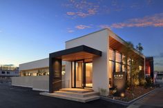 a modern house with an entry way leading to the front door