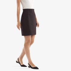 This fitted, petite-friendly number features vertical front seams and a smooth silhouette that can be worn with just about anything—tucked-in blouses, structured blazers, you name it. Elegant Fitted Skirt For Semi-formal Occasions, Short Pleated Skirt For Office, Chic Fitted Short Length Skort, Elegant Lined Mini Skirt For Fall, Chic Fitted Short Skort, Sleek Fitted Mini Skirt For Fall, Elegant Lined Mini Skort, Knee-length Relaxed Skirt For Work, Knee-length Mini Skirt For Office