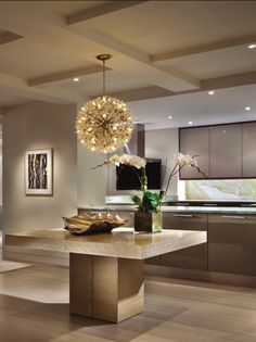 a modern kitchen with stainless steel appliances and wood flooring