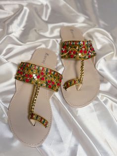 Kolhapuri juti, also known as Kolhapuri chappal, is a traditional South Asian footwear style originating from the Kolhapur region of Maharashtra. These chic sandals are handmade from leather and are known for their distinctive design, featuring intricate stitching and adorned with embellishments like beads and embroidery. Kolhapuri jutis are popular for their durability, comfort, and unique aesthetic, making them a favorite choice for both traditional and contemporary fashion statements. Luxury Traditional Sandals For Festivals, Womens Sandals Indian, Luxury Traditional Sandals For Festive Occasions, Traditional Luxury Sandals For Festive Occasions, Luxury Traditional Party Sandals, Luxury Traditional Sandals For Party, Luxury Traditional Sandals For Festive Season, Kolhapuri Chappals Woman Style, Pakistani Chappal