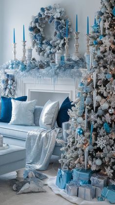 a living room decorated for christmas with blue and silver decorations