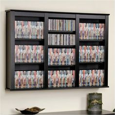 an entertainment center with many movies on the front and side shelves full of dvd's