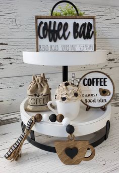 a coffee bar sign sitting on top of a white table