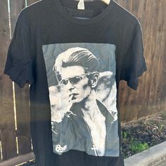 Black With David Bowie Graphic T Shirt Casual Oversized Streetwear Never Worn Cool Black Top With Graphic Print, Cool Black Crew Neck Top, Cool Black Top With Crew Neck, Edgy Black Shirt With Screen Print, Black Graphic Tee For Spring, Cool Black Summer Top, Black Summer Casual Top, Black Screen Print Shirt For Fall, Edgy Graphic Print Shirt For Spring