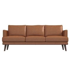 a brown leather couch with wooden legs