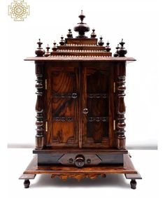 an old wooden cabinet with many knobs on the front and side doors, sitting on wheels