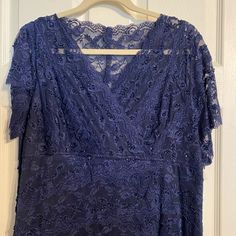 Marina Formal Sequin Lace Short Sleeve Dress. Navy Color. Absolutely Beautiful Detail And Beads Throughout. Lined. Lacy Sleeves. A Bit Form Fitting. Extra Sequins Included *Pictures Don’t Fully Capture Its Beauty! * Navy Blue Lace Dress With Sleeves, Marina Blue, Lace Short, Short Sleeve Dress, Navy Color, Lace Shorts, Sleeve Dress, Family Room, Sequin