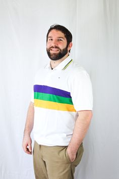 Celebrate Mardi Gras with this stylish white short sleeved Mardi Gras shirt. This shirt features purple, green and gold solid stripes across the chest. Small lines of purple, green and gold are around the collar. White Collared Shirt With Contrast Stripes, Green Short Sleeve Polo Shirt With Striped Collar, Green Polo Shirt With Striped Collar And Short Sleeves, White Polo Shirt With Contrast Stripes For Spring, Classic Purple Short Sleeve Polo Shirt, White Chest, Comedy And Tragedy, Mardi Gras Shirt, Beaded Hat