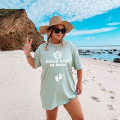 Introducing our "Beach Baby on Board" Comfort Colors shirt, perfect for your summer pregnancy announcement by the sea. Whether it's a cruise or beach vacation, share your joy in style. Ideal for baby showers or gender reveals, its soft fabric ensures comfort while flaunting your bump. Vacation Tops Upf 50+ For Beach Season, Beachy Tops With Upf 50+ For Vacation, Upf 50+ Tops For Beach Vacation, Beach Tops With Sun Protection And Short Sleeves, Blue Tops For Beach With Upf 50+, Blue Beach Tops With Upf 50+, Short Sleeve Tops With Upf 50+ For Beach, Casual Tops With Upf 50+ For Beach, Upf 50+ Short Sleeve Tops For Beach