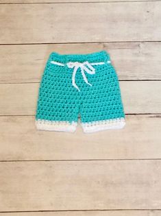 These cute surfer shorts will make a great photo prop or Halloween costume for those warmer climates!  If you would like these made in another color just message me!   Sizes are Newborn 0-3 mths 3-6 mths 6-12 mths Approx measurements Newborn -waist 13"                    waist to bottom-7" 0-3mths-waist 14"                  waist to bottom-8" 3-6mths-waist-                  waist to bottom- 6-12mths-waist-                   waist to bottom- I recommend spot clean only Thanks to Lori Lehue Photography for the wonderful photo! Newborn Swimsuit, Baby Shower Gift Cake, Surfer Shorts, Nurse Photos, Doctor Scrubs, Gift Cake, Baby Halloween Costumes, Newborn Photography Props, Baby Costumes