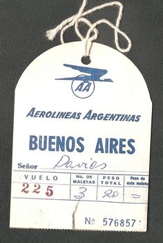 an airplane tag hanging from the side of a black leather jacket with writing on it