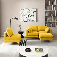 a living room with two yellow couches and a coffee table