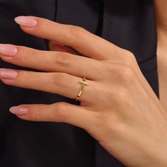 Embrace divine grace with our Dainty Cross Ring, a delicate and meaningful piece that symbolizes faith and spirituality. It features a dainty cross design, elegantly rendered in lustrous gold. The minimalist style adds a touch of modernity, while the symbolic cross represents devotion, hope, and love. Whether worn as a personal reminder of faith or as a fashionable accessory, our Dainty Cross Ring is a timeless choice that exudes both elegance and spiritual significance. - Made in 14k solid gold Ring With Cross, Delicate Gold Initial Ring With Simple Design, Gold Initial Ring With Simple Design, Gold Initial Ring Simple Design, Purity Ring Aesthetic, Simple Gold Initial Open Ring, Timeless Initial Ring For Promise, Elegant Yellow Gold Initial Ring With Simple Design, Elegant Cross-shaped Promise Ring