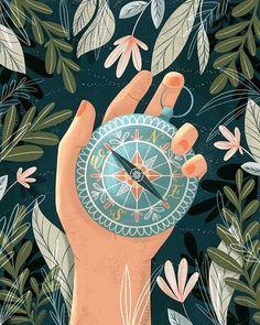 a person's hand holding a compass in front of plants and leaves on a blue background