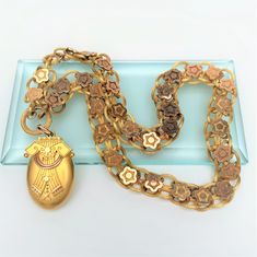 "This is a stunning Victorian era Etruscan revival style locket and chain. Each is made of 14k gold (tested). The piece is in excellent vintage condition with only very light age related wear. The chain measures 23\" long and .75\" wide. The locket measures 2.25\" long, 1.2\" wide and .6\" deep. The piece weighs 60.6 grams. If you have any questions or would like to see additional pictures, please contact us before making your purchase. Buyers outside the United States, please contact us for a s Vintage Gold Oval Link Locket Necklace, Vintage Gold Locket Necklace With Oval Link, Antique Yellow Gold Necklace With Historical Design, Antique Medallion Jewelry With Historical Design, Vintage Yellow Gold Jewelry With Historical Design, Antique Yellow Gold Necklace, Yellow Gold Locket Necklace With Vintage Charm For Collectors, Gold Medallion Jewelry With Historical Design, Gold Oval Jewelry With Historical Design