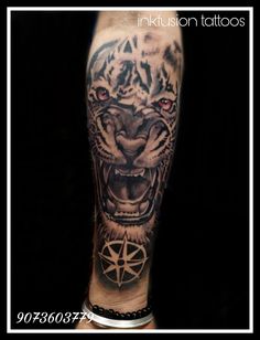 a man with a tiger tattoo on his arm