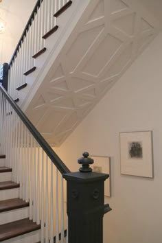 a stair case next to some stairs in a house