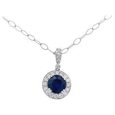 Our fine jewelry collection now includes a stunning sapphire gemstone pendant necklace that is sure to add a touch of elegance and sophistication to any outfit. This exquisite necklace is designed with a beautifully crafted 18K white gold chain that shimmers in the light and features a gorgeous round sapphire gemstone at the center, weighing 4.00 carats. The sapphire is surrounded by a halo of white round diamonds with a total weight of 0.80 carats, adding a touch of sparkle and brilliance to th Types Of Gold, Round Sapphire, Gemstone Necklace Pendant, Fine Jewelry Collection, Sapphire Gemstone, High Quality Jewelry, Gemstone Pendant, Gold Chain, Round Diamonds