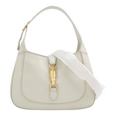 Gucci Jackie 1961 Small Leather Bag with Adjustable Strap Size White These are professional photos of the actual bag offered by Luxbags. The Gucci Jackie 1961 White Small bag is a modern take on an iconic design. Crafted in leather with a structured silhouette, it features a crossbody strap so you can bring your essentials wherever life takes you. Its baby blue hue is sure to add a touch of elegance to your wardrobe. CONDITION: EXCELLENT This preloved authentic bag is in excellent condition with minor signs of use throughout. Light creases on the shoulder strap, light rubbing around the corners DETAILS GUCCI Jackie 1961 White calfskin leather Beige suede lining Gold-tone hardware Piston lock Size Small Width: 27cm x Height: 18.5 x Depth 3.5cm ACCESSORY: Adjustable long shoulder strap Gucci Jackie 1961, Gucci Brand, Small Leather Bag, Authentic Bags, Classic Flap Bag, Professional Photos, Gucci Outfits, Gucci Tote, Iconic Design