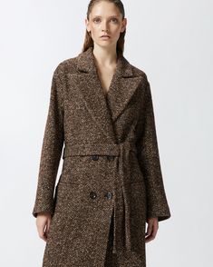 Women's ankle-length coat in wool-blend cloth embellished with herringbone pattern in shades of brown and camel. This straight-cut shape of this outerwear piece can be gathered at the waist by the matching belt in the same fabric, to tie however you like. Completing the design of this double-breasted, lined outerwear coat—ideal to wear every day—are the lapel collar and shoulders that are lightly padded for greater structure. Brown Belted Long Coat, Belted Brown Long Coat Outerwear, Brown Belted Long Coat Outerwear, Belted Wool Coat For Fall, Belted Long Brown Coat, Wool Outerwear With Belted Cuffs For Fall, Brown Double-breasted Outerwear With Belted Cuffs, Brown Double-breasted Tweed Outerwear, Wool Coat With Belted Cuffs For Fall