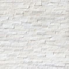 a white brick wall textured with small bricks