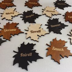 a bunch of wooden signs that are on a white table top with words written in them