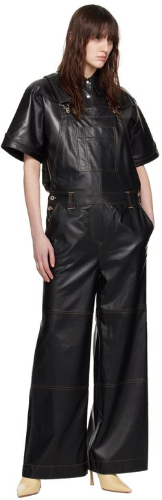 Buffed faux-leather overalls. · Square neck · Patch pocket at chest · Belt loops and buttoned vents at waist · Four-pocket styling · Mock-fly · Adjustable shoulder straps with buckle fastening · Contrast stitching in tan Supplier color: Black Leather Overalls, Chest Belt, Leather Coat Womens, Leather Jumpsuit, Stand Studio, Black Overalls, Prada Leather, Casual Jumpsuit, Contrast Stitch