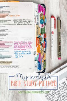 an open bible next to some pens and paper on a table with the words, my unplught bible study method