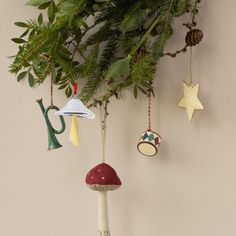 christmas ornaments hanging from a tree branch