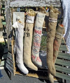 several pairs of socks are hanging on a wooden crate with other items in the background