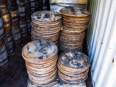 stacks of wooden barrels stacked on top of each other