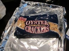 a bag of oyster crackers sitting on top of aluminum foil