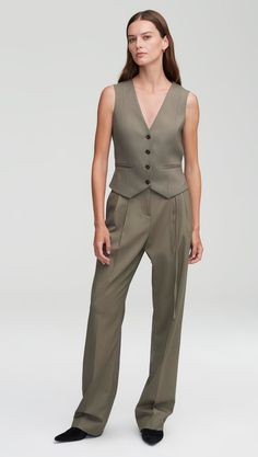 Elevate your workwear with a classic waistcoat. Designed to be worn as its own top or styled atop a blouse, our wool waistcoat reimagines traditional suiting for the modern working woman. The slim silhouette features functional pockets at the front, center-front button closures, and a stationary back belt. Tailored Button-up Vest For Workwear, Tailored Wool Sleeveless Vest, V-neck Workwear Vest With Button Closure, Suit Vest Women, Casual Church Outfits Summer, Summer Work Outfits Office Casual, Summer Bar Outfits, Tailored Single-breasted Wool Vest, Dinner Outfits Summer