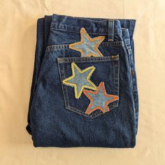 "Reworked vintage dark wash mid-rise jeans. These jeans are reworked with handmade light wash denim star patches in a mainly yellow and orange color pallate.  All pockets are fully functional. Original jeans are by Liz Claiborne Liz Wear. 100% cotton, made in Mexico. Marked a size 8- 31\" waist, 10\" rise, 39\" hips, 29\" inseam, 15\" leg opening. In great vintage condition with some very light vintage wear." White Tees Outfit, Patchwork Star, Reworked Clothes, Star Patches, Patchwork Clothes, Diy Jeans, Upcycle Clothes Diy, Reworked Vintage, Cute Pants