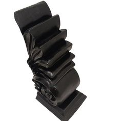 a stack of black objects on a white background