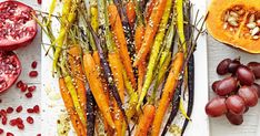 carrots, grapes and other fruits on a white plate with salt sprinkled over them