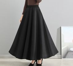 * A high-end long wool skirt, with wide elastic waist, very cool. * Made of wool blends, fully lined and with two side pockets. * Can custom make waist size and skirt length. * Material: Outer-50% wool, 50% polyester; lining-100% polyester * Washing instructions: Dry Clean Only * Size: True to US size, US 0-US 20 are available, you can let us know your usual size and height in your order. * Shipping: Free shipping Processing time : 5-7 Business days Delivery time : 7-20 Business days Tracking nu Black A-line Maxi Skirt For Winter, Black Full-length Skirt For Fall, Full Length Black Skirt For Fall, Black Full Length Winter Skirt, Winter Black Wide Leg Skirt, Winter Evening Maxi Skirt With Lining, Evening Maxi Skirt For Winter, Formal Black Wool Skirt, Flowy Maxi Skirt For Winter Evenings