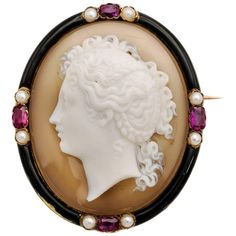 Four dazzling light pink rubies, eight fresh water pearls, hand carved agate with black enamel. Excellent craftsmanship as this is entirely carved of one piece of agate. Intricate detail, stunning and in excellent shape. This brooch has the Traditional French Eagle Stamp verifying its 18K yellow gold and most likely from the 1870's. A halo of bright rubies and pearls around a gorgeous young maiden. A wonderful piece. Slightly blemished on the lower left side of the enamel. Elegant Carved Agate Jewelry, Silver Pendant Lamp, St Michael Pendant, Gold Pearl Jewelry, Silver Diamond Necklace, Yellow Jewelry, Cameo Jewelry, Gold Locket, Yellow Gold Jewelry