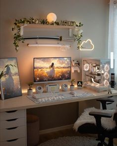 a desk with a computer on top of it next to a white chair and window