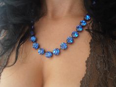 Blue Round Necklaces For Evening, Blue Rhinestone Jewelry For Gifts, Sapphire Necklaces With Jewels For Party, Faceted Round Jewelry For Evening, Party Jewelry With Sapphire And Sparkling Stones, Party Sapphire Necklace With Sparkling Stones, Blue Formal Jewelry With Stones, Formal Blue Jewelry With Stones, Formal Blue Stone Jewelry